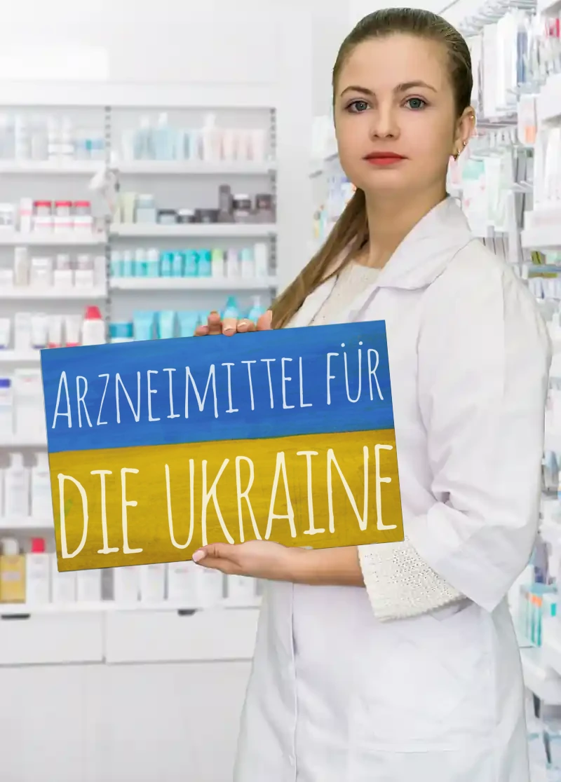 A person holding a Medicines to Ukraine poster